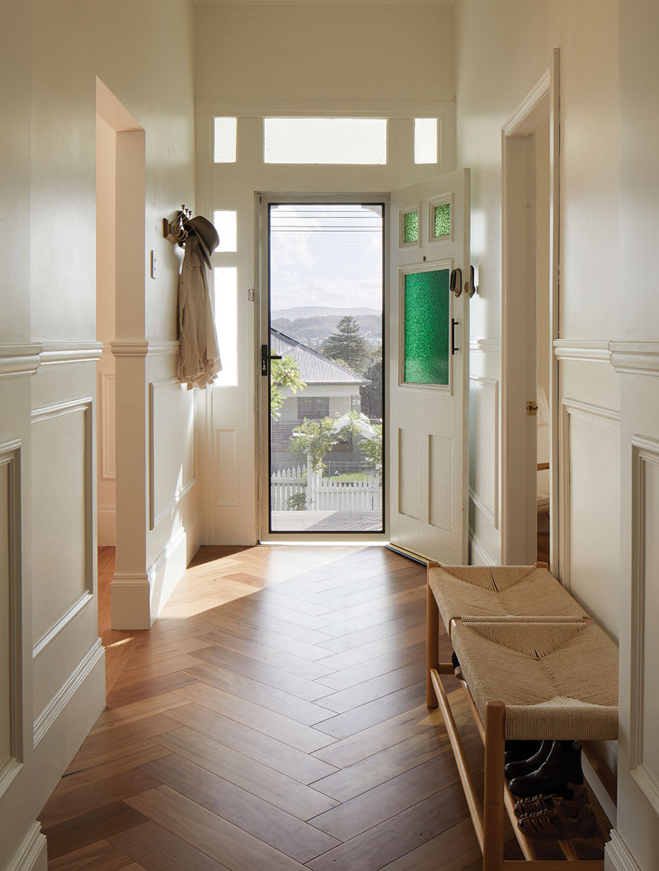 Hallway with brown wood floor